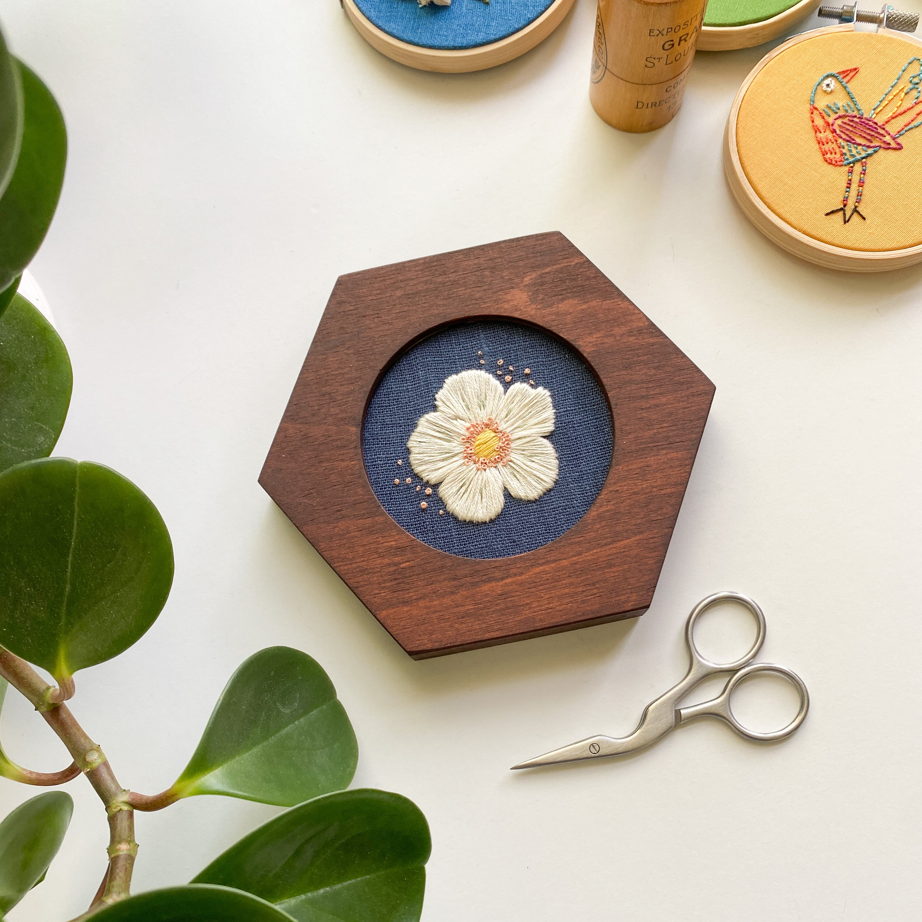 Harvest Goods Strawberry Flower shown in an alternative hoop: The 3" mini Hexagon in Caramel